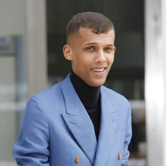 Stromae à la sortie du défilé de mode "Louis Vuitton", collection prêt-à-porter automne-hiver 2015/2016, à Paris. Le 11 mars 2015