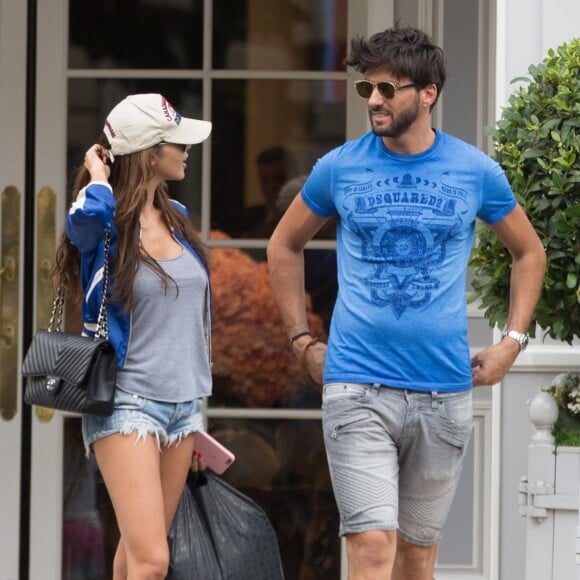 Exclusif - Nabilla Benattia et son chéri Thomas Vergara déjeunent chez "Pizza Pino" sur les Champs-Elysées et font du shopping sur l'Avenue Montaigne avec leur chien Pita à Paris, France, le 21 juillet 2016. © Agence/Bestimage