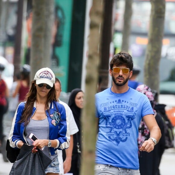 Exclusif - Nabilla Benattia et son compagnon Thomas Vergara déjeunent chez "Pizza Pino" sur les Champs-Elysées et font du shopping sur l'Avenue Montaigne avec leur chien Pita à Paris, France, le 21 juillet 2016. © Agence/Bestimage