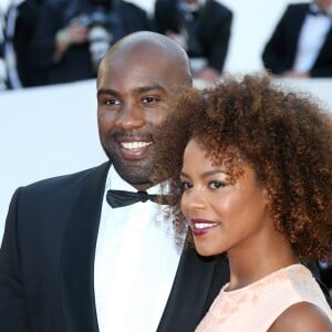 Teddy Riner et sa compagne Luthna lors de la montée des marches du film "Elle" lors du 69ème Festival International du Film de Cannes, le 21 mai 2016 à Cannes