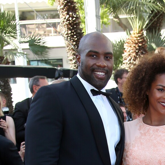 Teddy Riner et sa compagne Luthna lors de la montée des marches du film "Elle" lors du 69ème Festival International du Film de Cannes, le 21 mai 2016 à Cannes