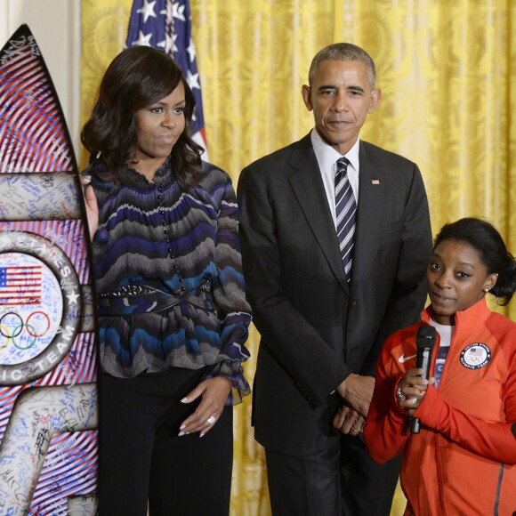 Barack Obama, Michelle Obama et Simone Biles, le 29 septembre 2016 à la Maison Blanche