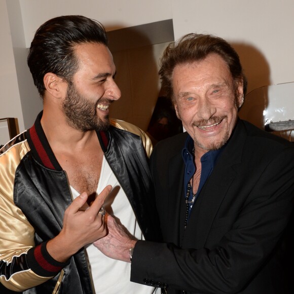Exclusif - Yodelice (Maxim Nucci) et Johnny Hallyday - Le joaillier Aaron Jah Stone et l'artiste Kongo ont présenté une nouvelle collection qui allie Street Art et Joaillerie chez Montaigne Market à Paris le 4 mars 2016.