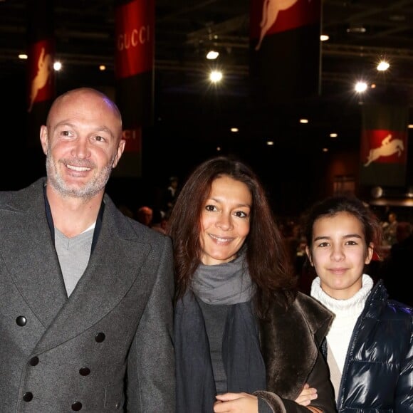 Frank Leboeuf avec sa compagne Chrislaure Nollet (ex-femme de Fabrice Santoro) et la fille de celle-ci Djenae aux Gucci Paris Masters 2013 a Villepinte le 8 decembre 2013.