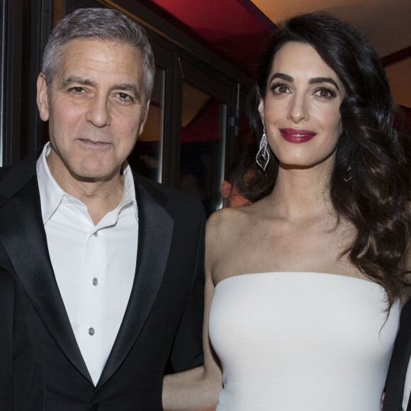 George Clooney et sa femme Amal Alamuddin (enceinte) - Dîner de la cérémonie des César au Fouquet's à Paris. Le 24 février 2017