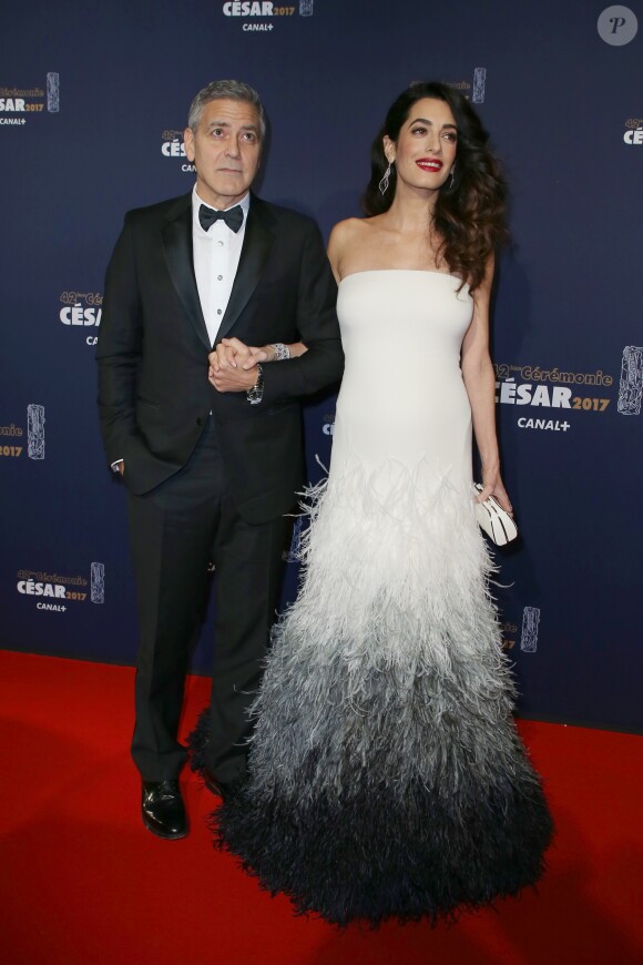 George Clooney (montre Omega) et sa femme Amal Alamuddin-Clooney (enceinte) arrivant à la 42ème cérémonie des César à la Salle Pleyel à Paris le 24 février 2017. © Olivier Borde / Dominique Jacovides / Bestimage