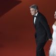 Exclusif - George Clooney (montre Omega) et sa femme Amal Alamuddin-Clooney (enceinte) arrivant à la 42ème cérémonie des César à la Salle Pleyel à Paris le 24 février 2017. © Pierre Pérusseau / Bestimage