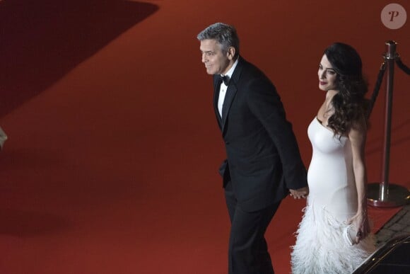 Exclusif - George Clooney (montre Omega) et sa femme Amal Alamuddin-Clooney (enceinte) arrivant à la 42ème cérémonie des César à la Salle Pleyel à Paris le 24 février 2017. © Pierre Pérusseau / Bestimage