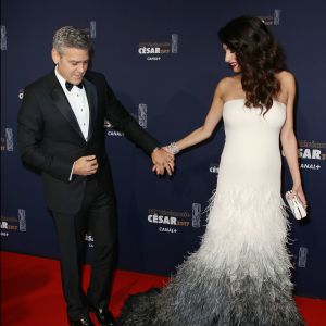 George Clooney (montre Omega) et sa femme Amal Alamuddin Clooney, enceinte et vêtue d'une robe Haute Couture Atelier Versace, assistent à la 42e cérémonie des César à la Salle Pleyel. Paris, le 24 février 2017. © Olivier Borde / Dominique Jacovides / Bestimage