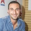 Michael Zazoun en séance de dédicaces chez Virgin Radio lors des Journées du Patrimoine à Paris, le 21 septembre 2014.