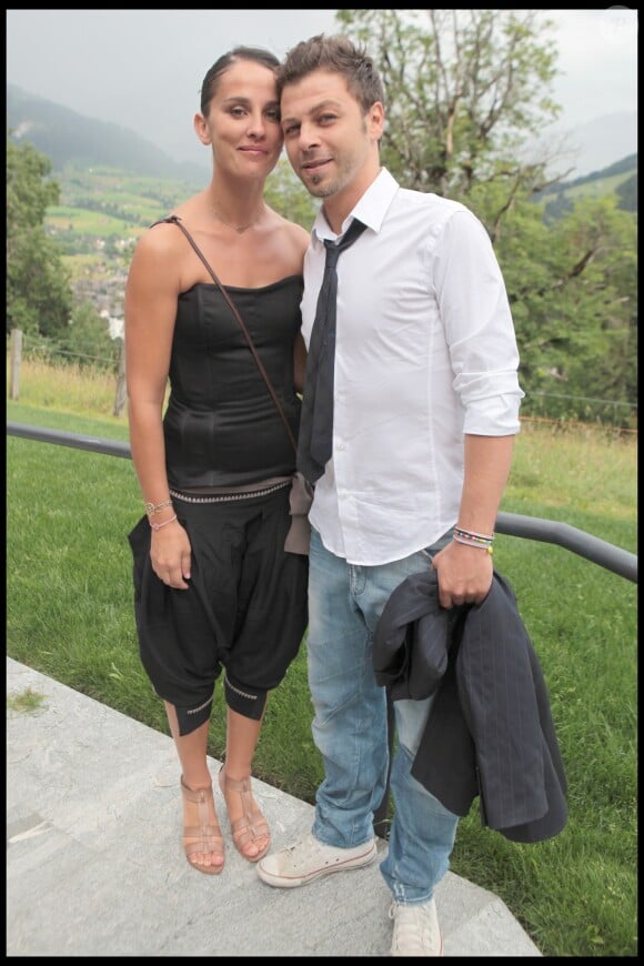 Exclusif - Christophe Maé (Martichon, de son vrai nom) et Nadège Sarron lors du baptême de Joy Hallyday à Lauenen en Suisse en juillet 2009. Le couple s'est marié civilement le 29 juin 2017 et religieusement le 1er juillet 2017 en Corse.