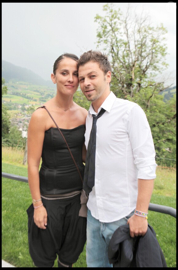 Exclusif - Christophe Maé (Martichon, de son vrai nom) et Nadège Sarron lors du baptême de Joy Hallyday à Lauenen en Suisse en juillet 2009. Le couple s'est marié civilement le 29 juin 2017 et religieusement le 1er juillet 2017 en Corse.