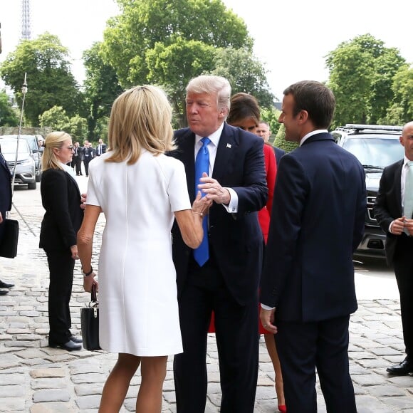 Le président de la République Emmanuel Macron, sa femme Brigitte Trogneux, le président des Etats-Unis Donald Trump et sa femme Melania Trump lors de la cérémonie d'accueil du président des Etats-Unis à l'Hôtel National des Invalides à Paris le 13 juillet 2017. © Dominique Jacovides/Bestimage