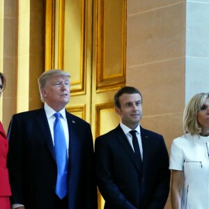 Le président de la République Emmanuel Macron, sa femme Brigitte Trogneux, le président des Etats-Unis Donald Trump et sa femme Melania Trump lors de la cérémonie d'accueil du président des Etats-Unis à l'Hôtel National des Invalides à Paris le 13 juillet 2017. © Dominique Jacovides/Bestimage