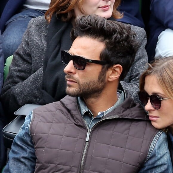 Maxim Nucci (Yodelice) et sa compagne Isabelle Ithurburu dans les tribunes des Internationaux de France de tennis de Roland Garros à Paris. Le 24 mai 2016 © Dominique Jacovides / Bestimage