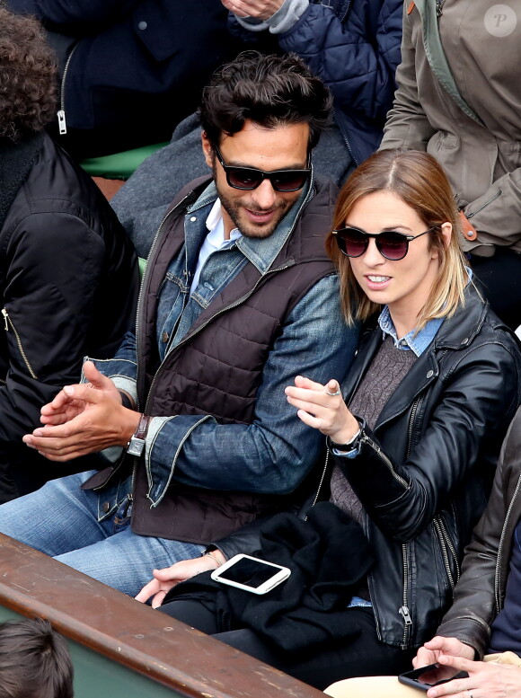 Maxim Nucci (Yodelice) et sa compagne Isabelle Ithurburu dans les tribunes des Internationaux de France de tennis de Roland Garros à Paris. Le 24 mai 2016 © Dominique Jacovides / Bestimage