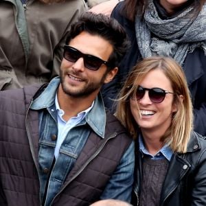 Maxim Nucci (Yodelice) et sa compagne Isabelle Ithurburu dans les tribunes des Internationaux de France de tennis de Roland Garros à Paris. Le 24 mai 2016 © Dominique Jacovides / Bestimage