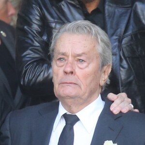 Pascal Desprez et Alain Delon - Sorties des obsèques de Mireille Darc en l'église Saint-Sulpice à Paris. Le 1er septembre 2017