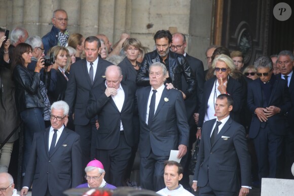Pascal Desprez et Alain Delon - Sorties des obsèques de Mireille Darc en l'église Saint-Sulpice à Paris. Le 1er septembre 2017
