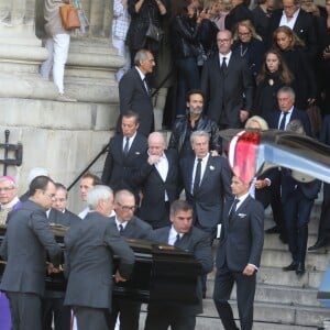 Pascal Desprez et Alain Delon - Sorties des obsèques de Mireille Darc en l'église Saint-Sulpice à Paris. Le 1er septembre 2017