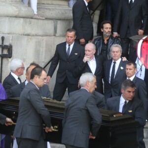 Pascal Desprez et Alain Delon - Sorties des obsèques de Mireille Darc en l'église Saint-Sulpice à Paris. Le 1er septembre 2017