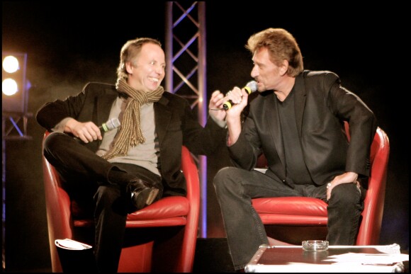 Fabrice Luchini et Johnny Hallyday pour la promotion de leur film "Jean-Philippe" au Grand Rex, à Paris, le 20 mars 2006.