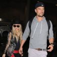 Fergie et son mari Josh Duhamel arrivent à l'aéroport de Los Angeles, en provenance de New York. Le 11 juin 2014.