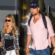 La chanteuse Fergie et son mari Josh Duhamel arrivent à l'aéroport de JFK à New York, le 9 juin 2014.