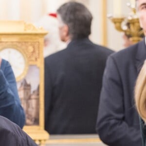 Le président Emmanuel Macron et sa femme Brigitte lors de l'arbre de Noël de l'Elysée à Paris le 13 décembre 2017. © Eliot Blondet / Pool / Bestimage 