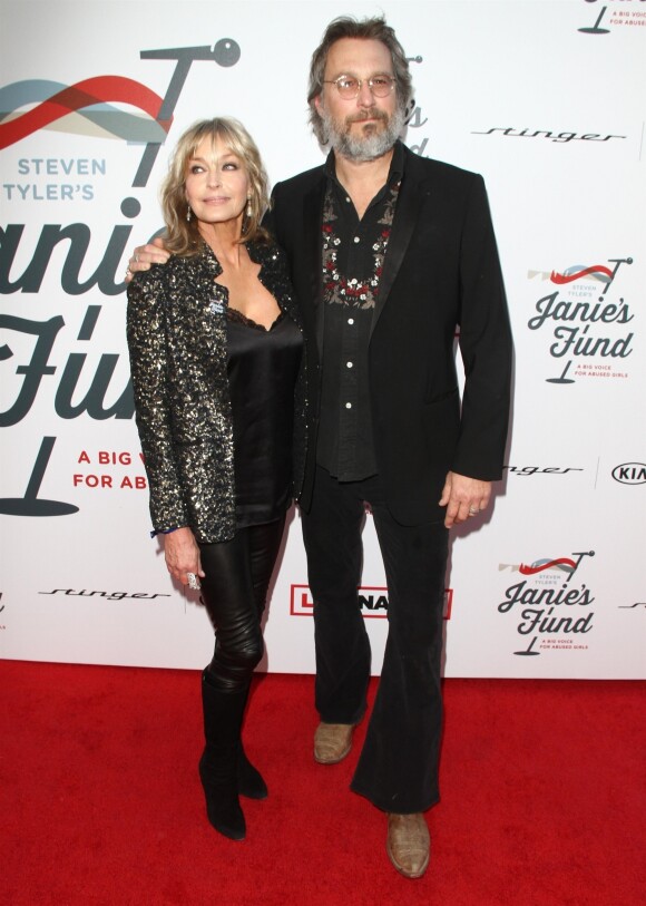 Bo Derek et son compagnon John Corbett à la soirée caritative Janie's Fund and Grammy Awards Viewing à Hollywood, le 28 janvier 2018