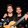 Kendji Girac pose au côté de sa statue au musée Grévin à Paris, le 8 mars 2017. © Guirec Coadic/Bestimage