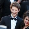 Le pilote de Formule 1 Romain Grosjean et sa compagne Marion Jollès - Montée des marches du film "Killing Them Softly" lors du 65e Festival de Cannes, le 22 mai 2012.