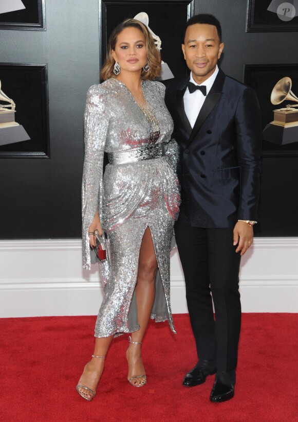 Chrissy Teigen enceinte et son mari John Legend aux 60e Grammy Awards au Madison Square Garden à New York, le 28 janvier 2018.