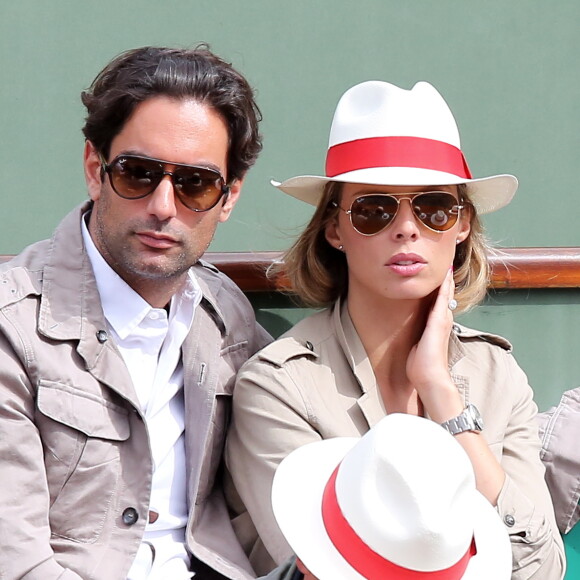 Sylvie Tellier et son compagnon Laurent - Jour 7 - People aux Internationaux de France de tennis a Roland Garros a Paris le 2 juin 2013.
