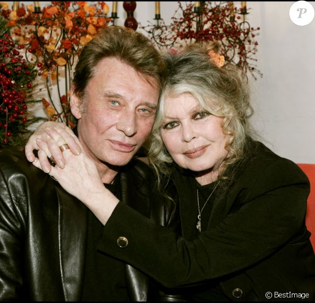 Johnny Hallyday et Brigitte Bardot lors du Noël des animaux de Levallois-Perret en 2004