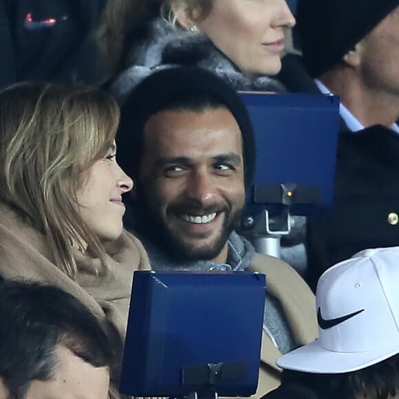 Maxim Nucci et sa compagne Isabelle Ithurburu, enceinte, assistent à l'élimination du PSG en huitièmes de finale retour de Ligue des Champion contre le Real Madrid au Parc des Princes à Paris le 6 mars 2018. © Cyril Moreau/Bestimage