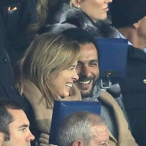 Maxim Nucci et sa compagne Isabelle Ithurburu, enceinte, assistent à l'élimination du PSG en huitièmes de finale retour de Ligue des Champion contre le Real Madrid au Parc des Princes à Paris le 6 mars 2018. © Cyril Moreau/Bestimage