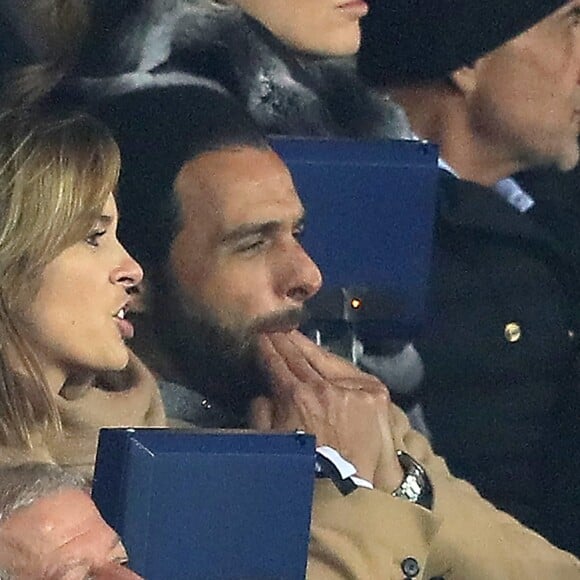 Maxim Nucci et sa compagne Isabelle Ithurburu, enceinte, assistent à l'élimination du PSG en huitièmes de finale retour de Ligue des Champion contre le Real Madrid au Parc des Princes à Paris le 6 mars 2018. © Cyril Moreau/Bestimage