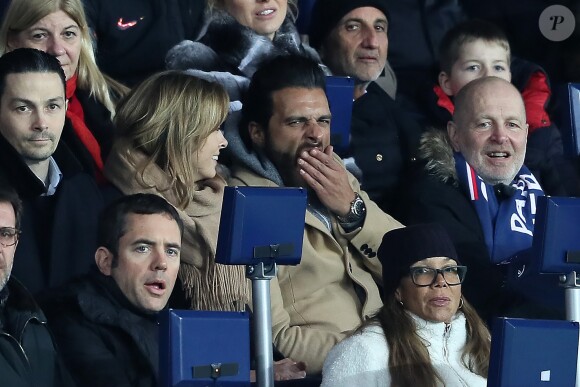 Maxim Nucci et sa compagne Isabelle Ithurburu, enceinte, assistent à l'élimination du PSG en huitièmes de finale retour de Ligue des Champion contre le Real Madrid au Parc des Princes à Paris le 6 mars 2018. © Cyril Moreau/Bestimage