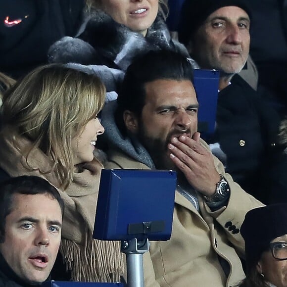 Maxim Nucci et sa compagne Isabelle Ithurburu, enceinte, assistent à l'élimination du PSG en huitièmes de finale retour de Ligue des Champion contre le Real Madrid au Parc des Princes à Paris le 6 mars 2018. © Cyril Moreau/Bestimage