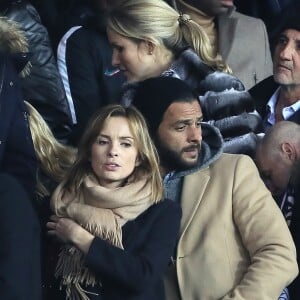 Maxim Nucci et sa compagne Isabelle Ithurburu, enceinte, assistent à l'élimination du PSG en huitièmes de finale retour de Ligue des Champion contre le Real Madrid au Parc des Princes à Paris le 6 mars 2018. © Cyril Moreau/Bestimage