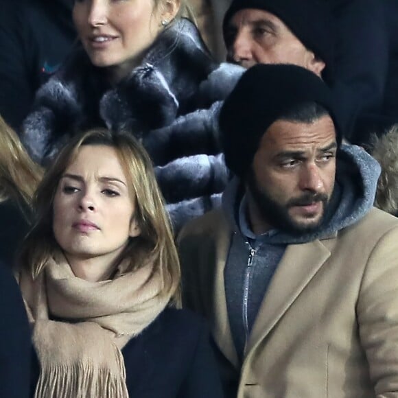 Maxim Nucci et sa compagne Isabelle Ithurburu, enceinte, assistent à l'élimination du PSG en huitièmes de finale retour de Ligue des Champion contre le Real Madrid au Parc des Princes à Paris le 6 mars 2018. © Cyril Moreau/Bestimage