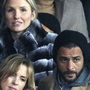 Maxim Nucci et sa compagne Isabelle Ithurburu, enceinte, assistent à l'élimination du PSG en huitièmes de finale retour de Ligue des Champion contre le Real Madrid au Parc des Princes à Paris le 6 mars 2018. © Cyril Moreau/Bestimage