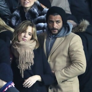 Maxim Nucci et sa compagne Isabelle Ithurburu, enceinte, assistent à l'élimination du PSG en huitièmes de finale retour de Ligue des Champion contre le Real Madrid au Parc des Princes à Paris le 6 mars 2018. © Cyril Moreau/Bestimage