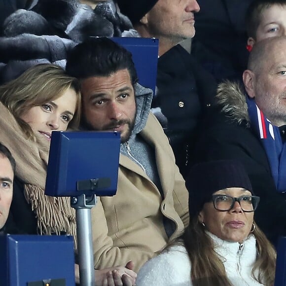 Maxim Nucci et sa compagne Isabelle Ithurburu, enceinte, assistent à l'élimination du PSG en huitièmes de finale retour de Ligue des Champion contre le Real Madrid au Parc des Princes à Paris le 6 mars 2018. © Cyril Moreau/Bestimage