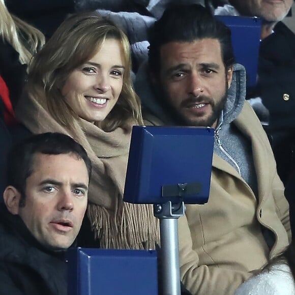 Maxim Nucci et sa compagne Isabelle Ithurburu, enceinte, assistent à l'élimination du PSG en huitièmes de finale retour de Ligue des Champion contre le Real Madrid au Parc des Princes à Paris le 6 mars 2018. © Cyril Moreau/Bestimage