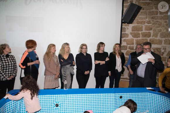 Régine Teyssot, Dominique Dimey, Christiane Jean, Véronica Antonelli, Isabelle Ithurburu, Valérie Trierweiler, Christian Rauth - Tirage national du Don'actions du Secours Populaire à Paris, le 16 mars 2018.