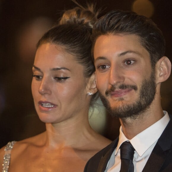 Pierre Niney (Smoking Dior, chaussures Louboutin, Bijoux Montblanc) et sa compagne Natasha Andrews (Robe Dior, chaussures Louboutin, bijoux Cartier) - Arrivées au dîner de la 42e cérémonie des César au Fouquet's à Paris. Le 24 février 2017 © Pierre Perusseau / Bestimage