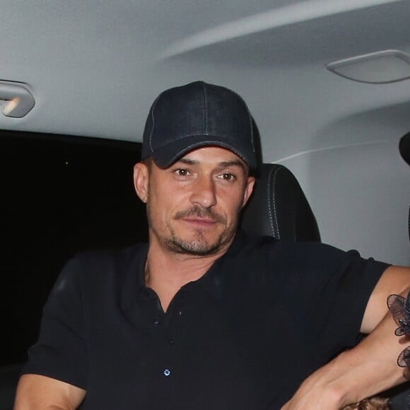 Orlando Bloom et sa compagne Katy Perry arrivent ensemble et main dans la main au "Chiltern Firehouse" à Londres le 16 juin 2018.