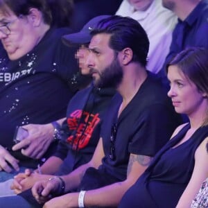 Maxim Nucci (Yodelice) et sa compagne enceinte Isabelle Ithurburu - Maxim Nucci (Yodelice) et sa compagne enceinte Isabelle Ithurburu assistent au match de boxe de Tony Yoka au palais des sports de Paris, le 23 juin 2018 © Veeren-CVS/Bestimage